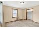 Bedroom featuring neutral paint and carpet, a window, and closet at 6616 S Cross St, Pendleton, IN 46064
