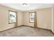 Neutral bedroom featuring two windows, plush carpet, and modern window treatments at 6616 S Cross St, Pendleton, IN 46064