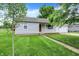 Charming one-story house featuring a well-kept lawn, tidy landscaping, and an attached garage at 6616 S Cross St, Pendleton, IN 46064