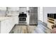 Bright kitchen with stainless appliances, durable floors, and updated finishes at 6616 S Cross St, Pendleton, IN 46064