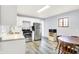 Updated kitchen with stainless steel appliances, stylish flooring, and eat-in dining area at 6616 S Cross St, Pendleton, IN 46064
