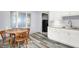 Eat-in kitchen featuring light cabinetry, modern counters, and stainless steel appliances at 6616 S Cross St, Pendleton, IN 46064