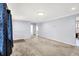 Spacious living room with soft carpet, blue walls, neutral trim, and lots of sunlight at 6616 S Cross St, Pendleton, IN 46064