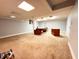 Unfinished basement area with large office desk and lighting at 7038 E 65Th St, Indianapolis, IN 46256