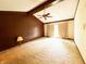 An open bedroom with natural lighting, a ceiling fan, and soft carpet, creating a cozy and inviting space at 7038 E 65Th St, Indianapolis, IN 46256