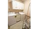 Spacious laundry room with washer, dryer, utility sink and built-in cabinets at 7038 E 65Th St, Indianapolis, IN 46256