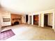 Spacious living room with a fireplace and built in cabinets at 7038 E 65Th St, Indianapolis, IN 46256