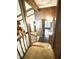 Staircase to the lower level shows wood detailing and access to other rooms in the home at 7038 E 65Th St, Indianapolis, IN 46256