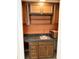 Functional wet bar with sink, ample cabinet storage, and convenient microwave space at 7038 E 65Th St, Indianapolis, IN 46256
