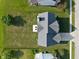 Aerial view of a home with a large backyard and patio at 7356 Woodington Pl, Indianapolis, IN 46259
