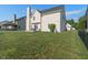 Expansive backyard with a well-maintained lawn and patio, offering ample space for outdoor activities and entertaining at 7356 Woodington Pl, Indianapolis, IN 46259