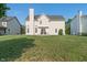 Lush backyard featuring a large lawn and comfortable patio area, perfect for relaxing and enjoying outdoor living at 7356 Woodington Pl, Indianapolis, IN 46259
