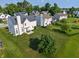 Aerial view showcasing a home's extensive green backyard with a cozy patio space at 7356 Woodington Pl, Indianapolis, IN 46259