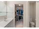 Bathroom with a walk-in closet, sink, and toilet at 7356 Woodington Pl, Indianapolis, IN 46259