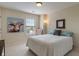 Comfortable bedroom featuring a large window and cow painting at 7356 Woodington Pl, Indianapolis, IN 46259