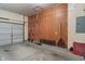 Clean and organized garage with a pegboard wall, providing ample storage and workspace at 7356 Woodington Pl, Indianapolis, IN 46259