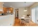 Charming eat-in kitchen with a white table and chairs, and views of the stainless steel appliances at 7356 Woodington Pl, Indianapolis, IN 46259