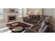 Comfortable living room features a plush sofa and a fireplace, perfect for relaxing and entertaining at 7356 Woodington Pl, Indianapolis, IN 46259