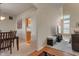 Open-concept design with a cozy living room featuring a fireplace, seamlessly connected to the kitchen and dining area at 7356 Woodington Pl, Indianapolis, IN 46259
