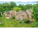 Aerial view of the property showcasing multiple units with spacious backyards and lush greenery at 7414 Harbour, Indianapolis, IN 46240