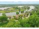 Scenic aerial view of waterfront homes nestled around a beautiful lake with lush greenery at 7414 Harbour, Indianapolis, IN 46240