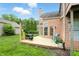 Inviting back deck features a grill, seating and a view of the lush green yard at 7414 Harbour, Indianapolis, IN 46240