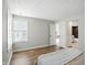 Spacious bedroom with hardwood floors and natural light from a large window at 7414 Harbour, Indianapolis, IN 46240