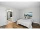 Comfortable bedroom with hardwood floors, a ceiling with texture and a decorative art piece at 7414 Harbour, Indianapolis, IN 46240