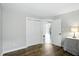 Bedroom with wood floors and a large closet with view into the living room at 7414 Harbour, Indianapolis, IN 46240