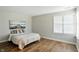 Serene bedroom featuring natural light, hardwood floors, and decorative wall art at 7414 Harbour, Indianapolis, IN 46240