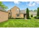 Beautiful front exterior featuring a well-manicured lawn and professional landscaping at 7414 Harbour, Indianapolis, IN 46240