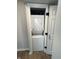 A convenient, stacked washer and dryer unit tucked into a closet with a bi-fold door at 7414 Harbour, Indianapolis, IN 46240