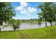 Scenic view of the lake with lush green surroundings and well-maintained community landscaping at 7414 Harbour, Indianapolis, IN 46240
