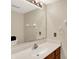 Bathroom with vanity sink and faucet, mirror, and lighting at 7720 Langwood Dr, Indianapolis, IN 46268