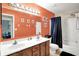 Bathroom with double vanity, toilet and shower-tub at 7720 Langwood Dr, Indianapolis, IN 46268