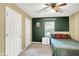 Cozy bedroom with neutral carpet, natural light, and large closets at 7720 Langwood Dr, Indianapolis, IN 46268