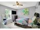 Bedroom features a large bed, a flat screen television, and bedside furniture at 7720 Langwood Dr, Indianapolis, IN 46268