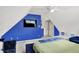Bright bedroom features natural light, blue accents, and a bed at 7720 Langwood Dr, Indianapolis, IN 46268