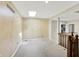 Large, open bonus room with neutral carpet and a skylight for natural light at 7720 Langwood Dr, Indianapolis, IN 46268