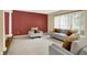 Bright living room with large windows, plush seating, neutral carpet, and stylish accent wall at 7720 Langwood Dr, Indianapolis, IN 46268
