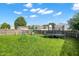 Large backyard featuring green grass, play set, and trampoline for Gathering fun and entertainment at 7906 States Bend Ln, Indianapolis, IN 46239