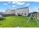 Spacious backyard with lawn, play equipment, and fenced perimeter at 7906 States Bend Ln, Indianapolis, IN 46239