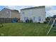 Expansive backyard featuring lush green grass and recreational play structures, perfect for outdoor activities and relaxation at 7906 States Bend Ln, Indianapolis, IN 46239