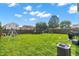 Spacious fenced backyard featuring a trampoline and play set, perfect for outdoor fun at 7906 States Bend Ln, Indianapolis, IN 46239