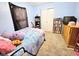 This blue bedroom features a closet, shelving, and a dresser at 7906 States Bend Ln, Indianapolis, IN 46239