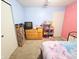 This charming bedroom features blue and pink walls, creating a whimsical and playful space at 7906 States Bend Ln, Indianapolis, IN 46239