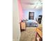 Colorful bedroom with a cozy bed, carpet flooring, and ceiling fan at 7906 States Bend Ln, Indianapolis, IN 46239
