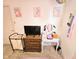 Bedroom featuring a vanity, dresser, television and unicorn decor at 7906 States Bend Ln, Indianapolis, IN 46239