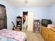 This blue bedroom features a closet, shelving, and a dresser at 7906 States Bend Ln, Indianapolis, IN 46239