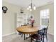 Cozy dining area with a wooden table, seating for four, and a bright window offering natural light at 7906 States Bend Ln, Indianapolis, IN 46239